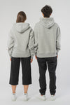 U-STSU856-Boxy-Hoodie-aus-Bio-Baumwolle-Bio-Baumwolle-Kleidung-Unisex-SAIGA-Heather-Grey-Vorne1