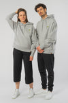 U-STSU856-Boxy-Hoodie-aus-Bio-Baumwolle-Bio-Baumwolle-Kleidung-Unisex-SAIGA-Heather-Grey-Vorne2